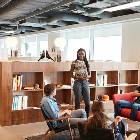 Professional team in a modern office setting participating in a corporate culture training session
