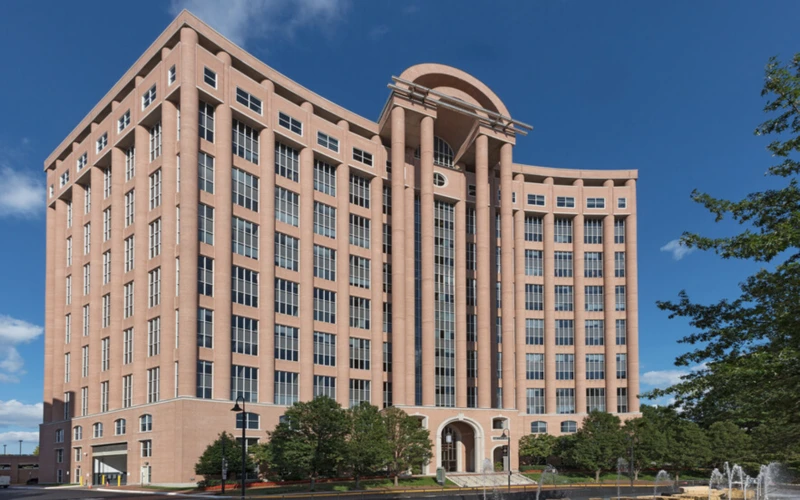 Berlitz Language Center in Tysons Corner, Virginia, housed in a modern office building with a curved facade and fountain in the foreground.